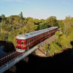 Biron Bay's solar train crossing the rail bridge