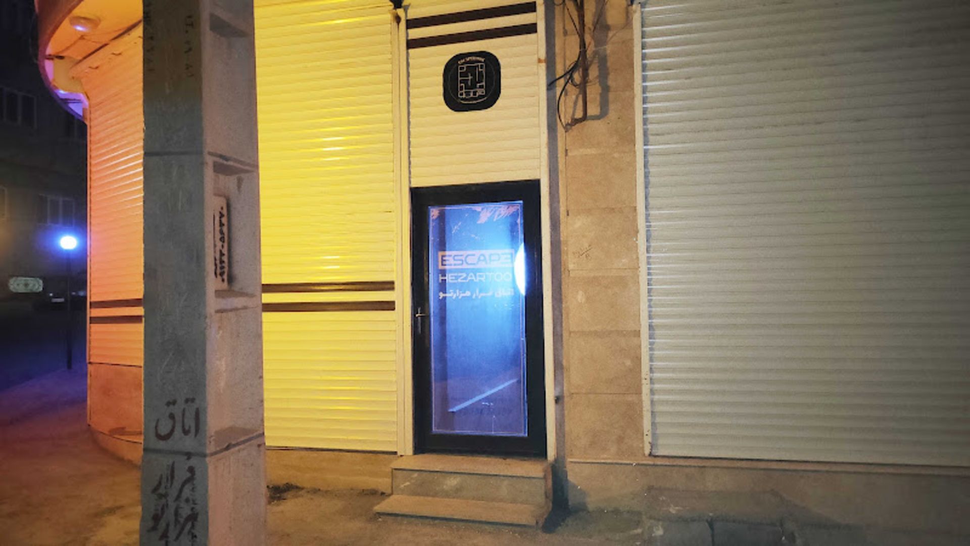 The erance door of the labyr's escape room next to the power beam
