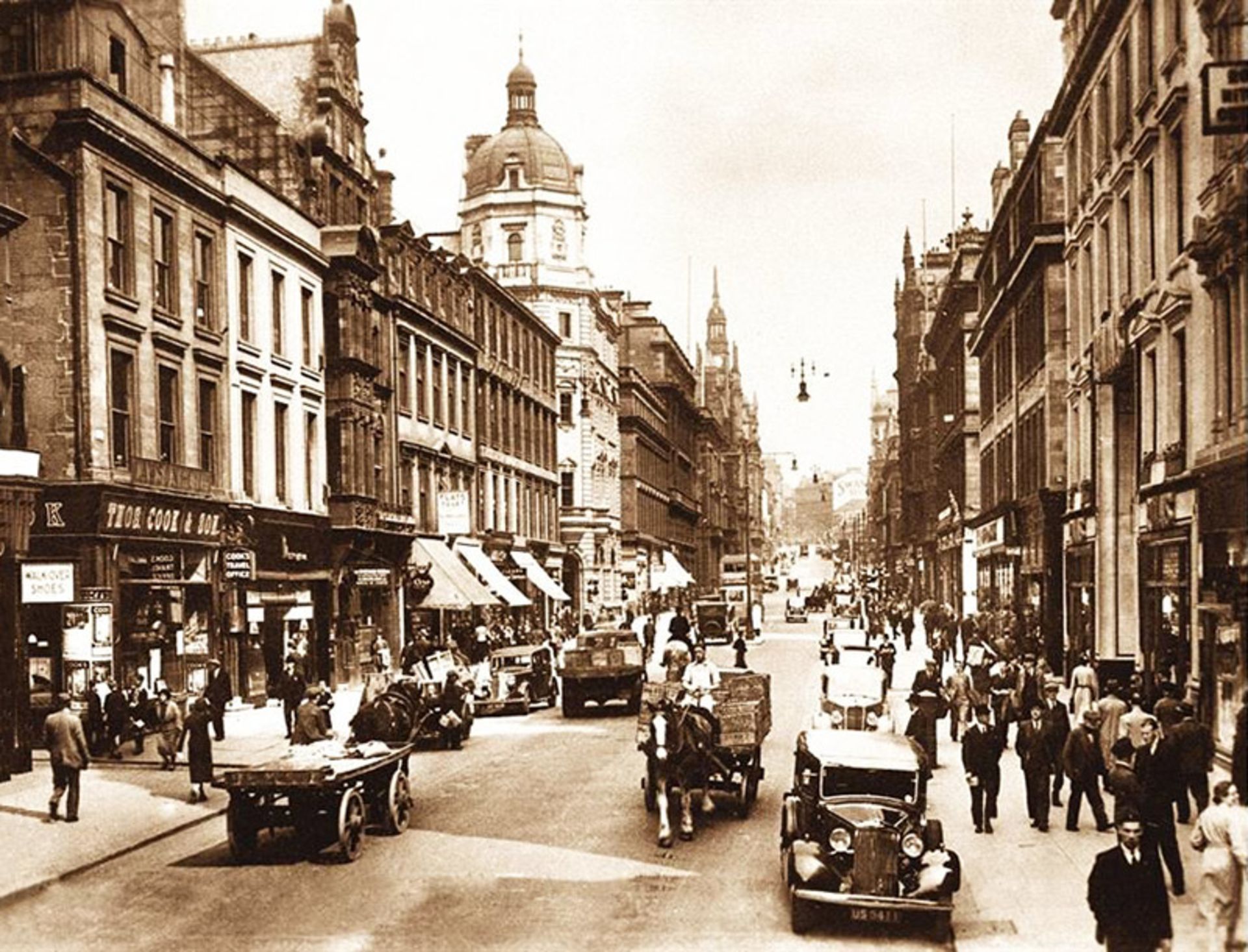 Street with classic structures and cars in Glasgow, Scotland