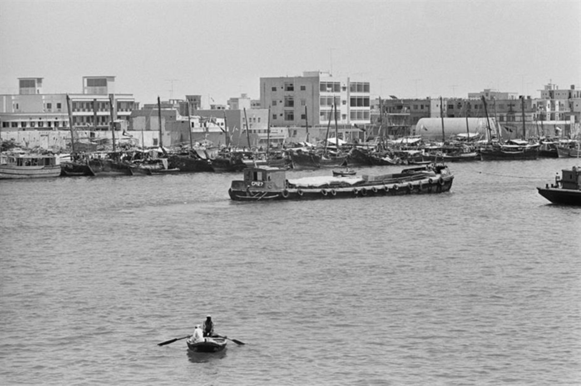 Old photo on Dubai and boats on water