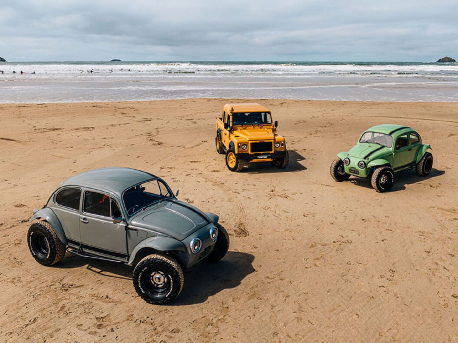 Differe Cars of the Company on the Beach