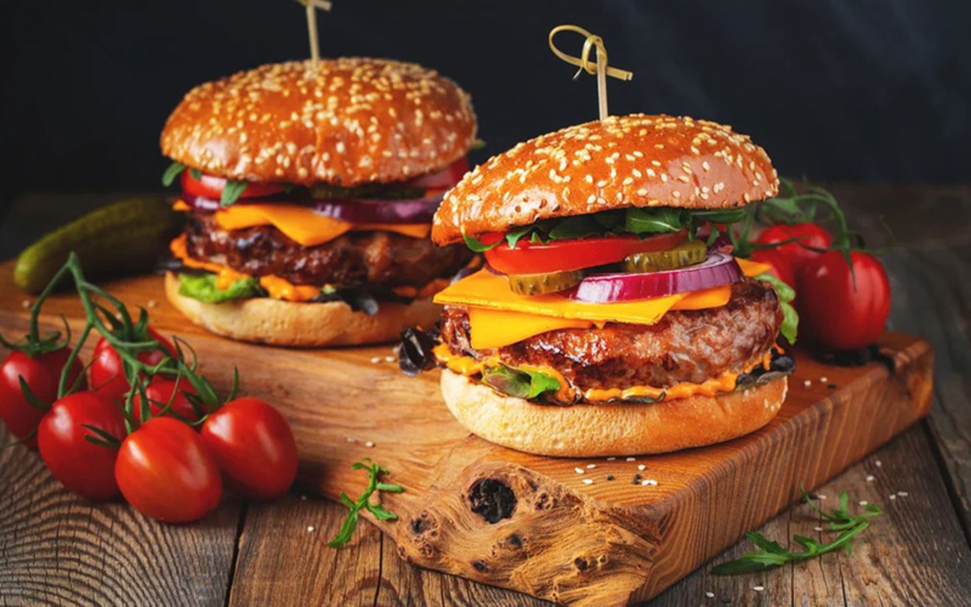 Two medium hamburgers with tomatoes