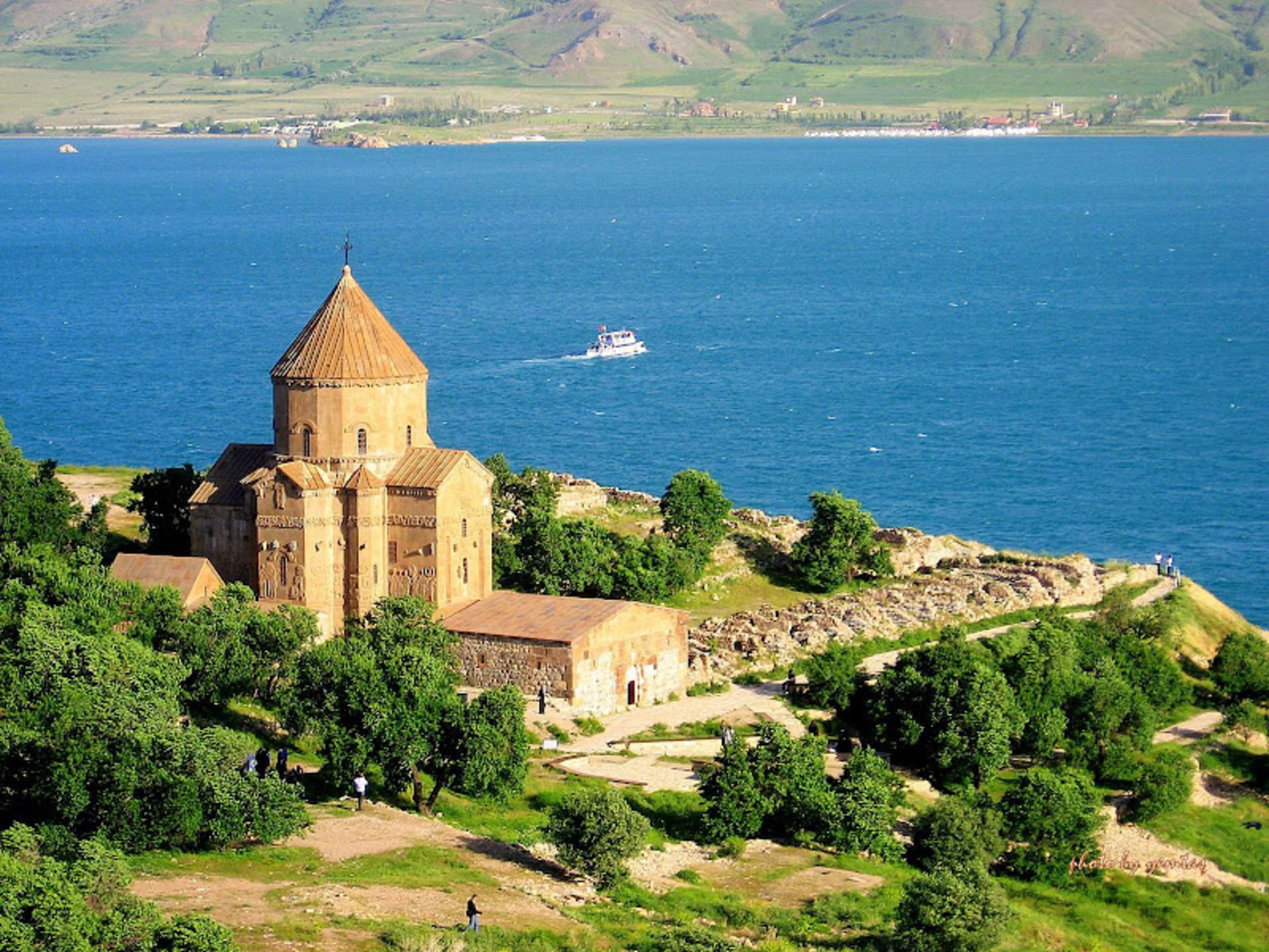 A view of Lake Van with a magnifice building in the city of Van 