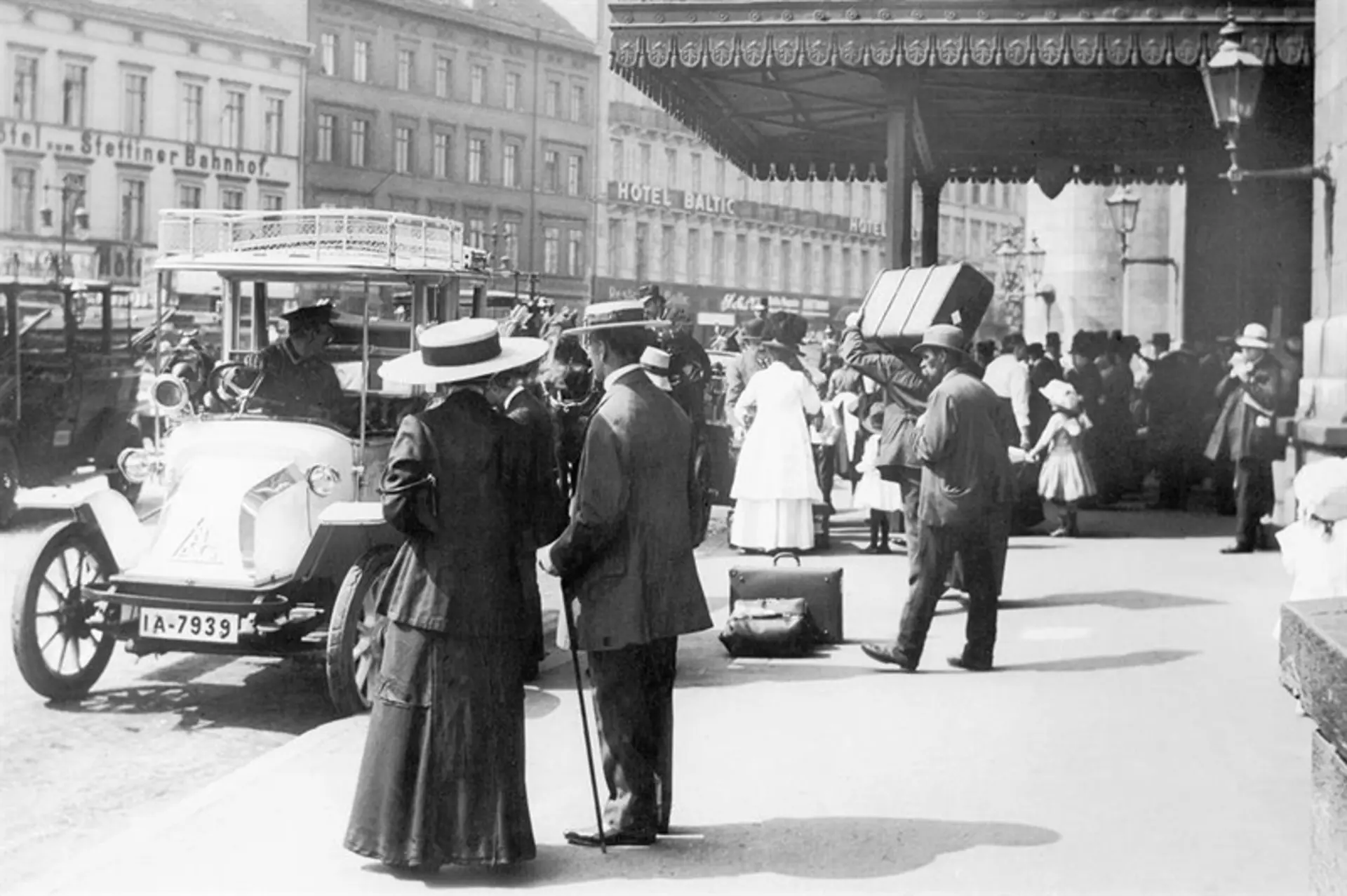 Old photo of the people at the train station in Stuttgart, Germany