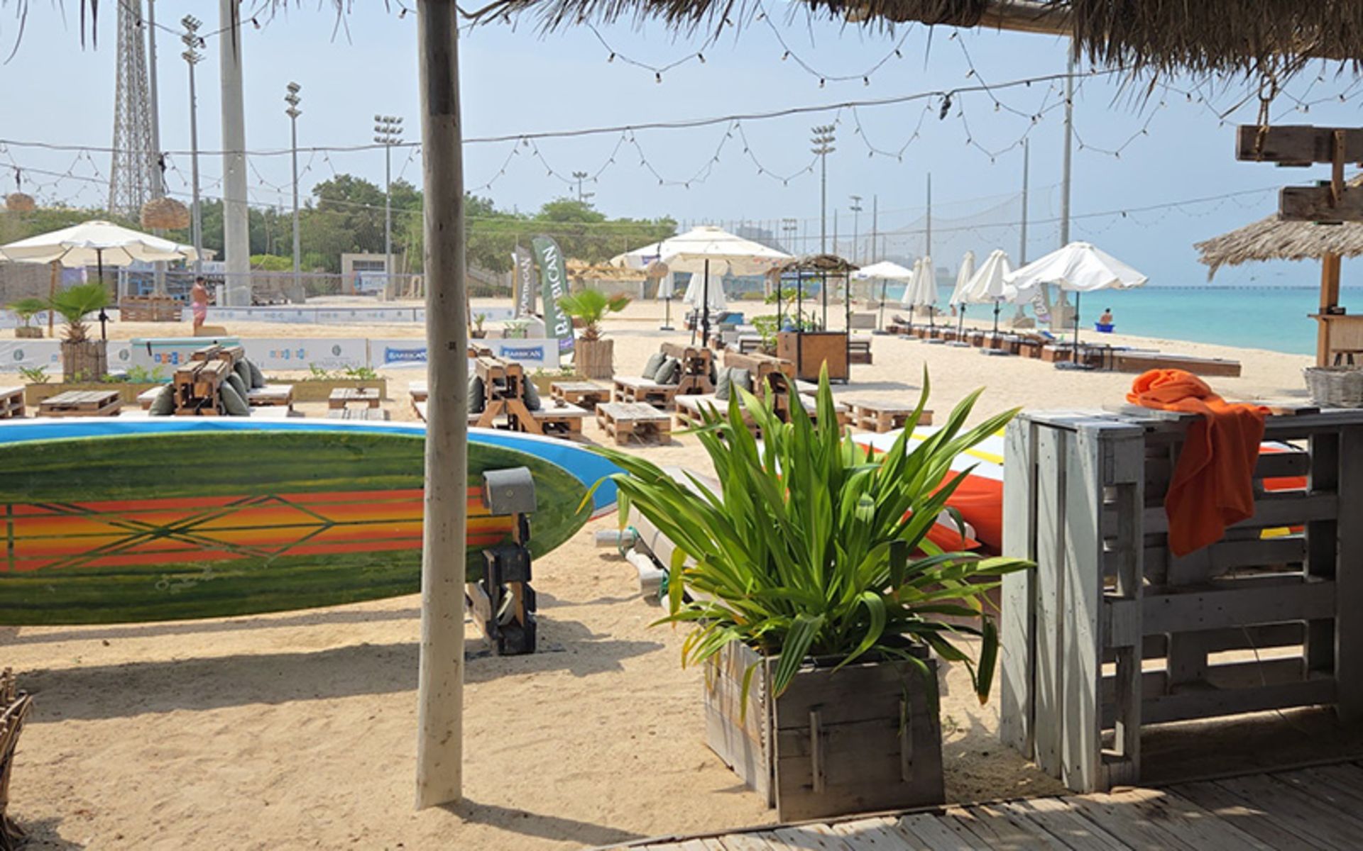 Beach with sunbathing beds in the geleman of Men Kish