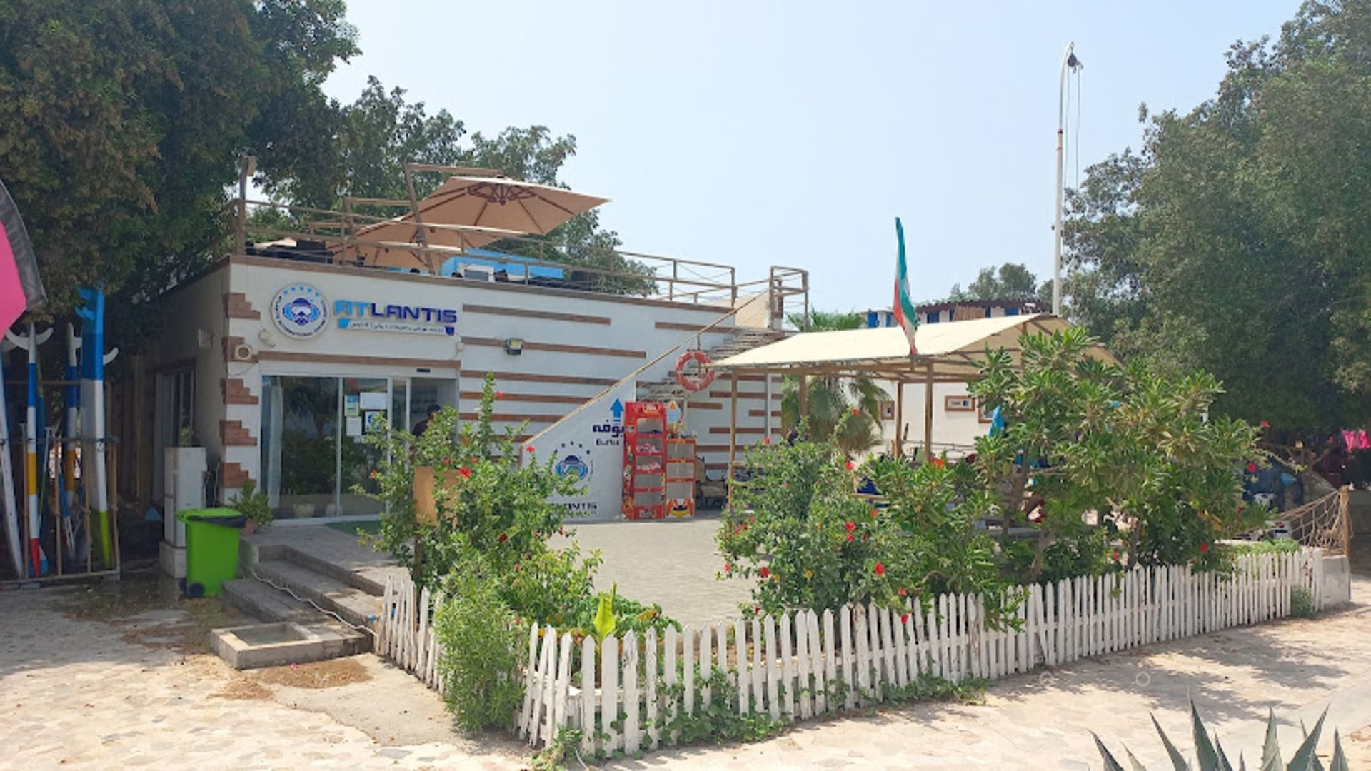 Ahlahis Club with green trees and boating equipme