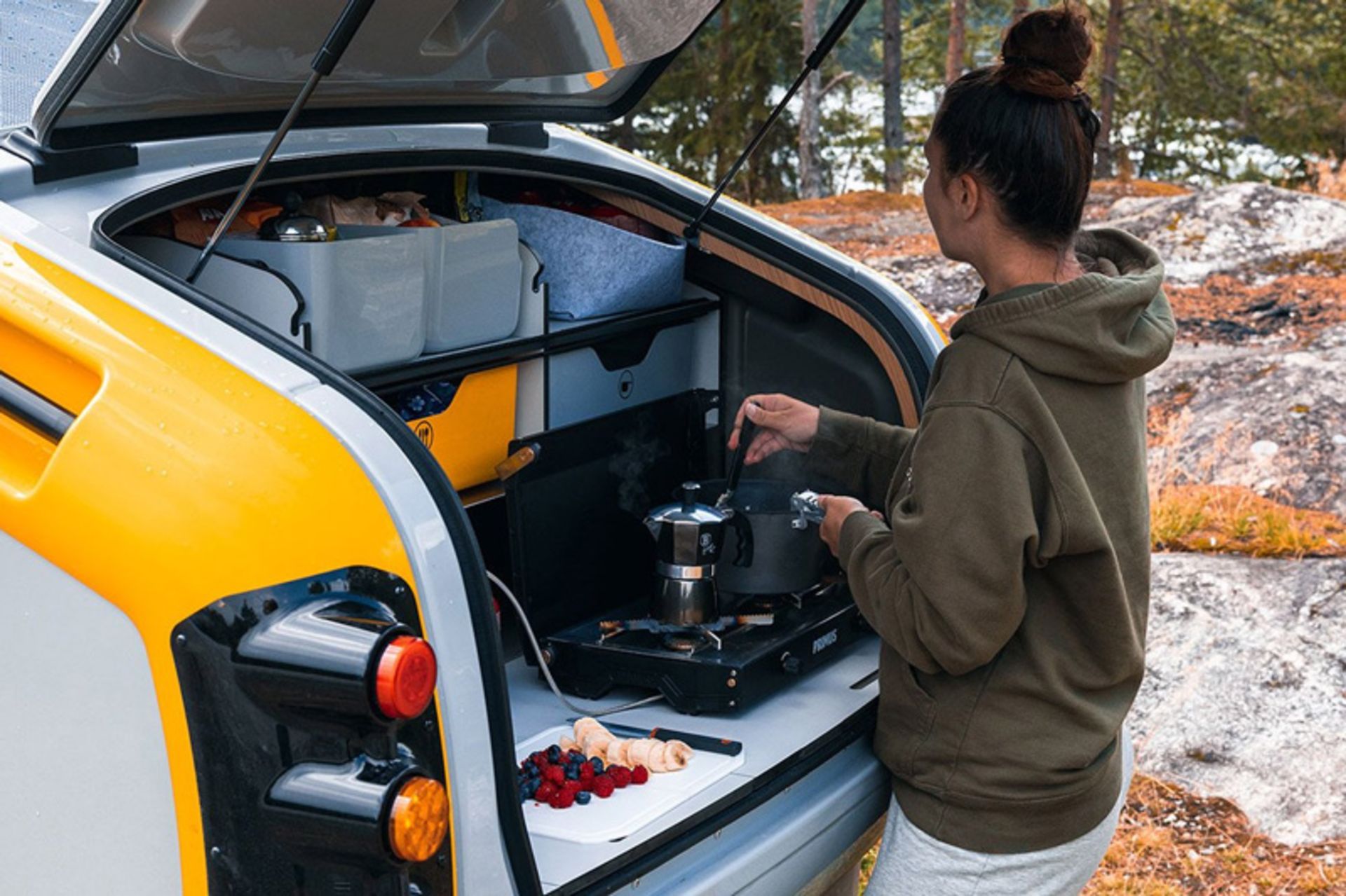 Cooking in the kitchen space of the Minkee camping trailer