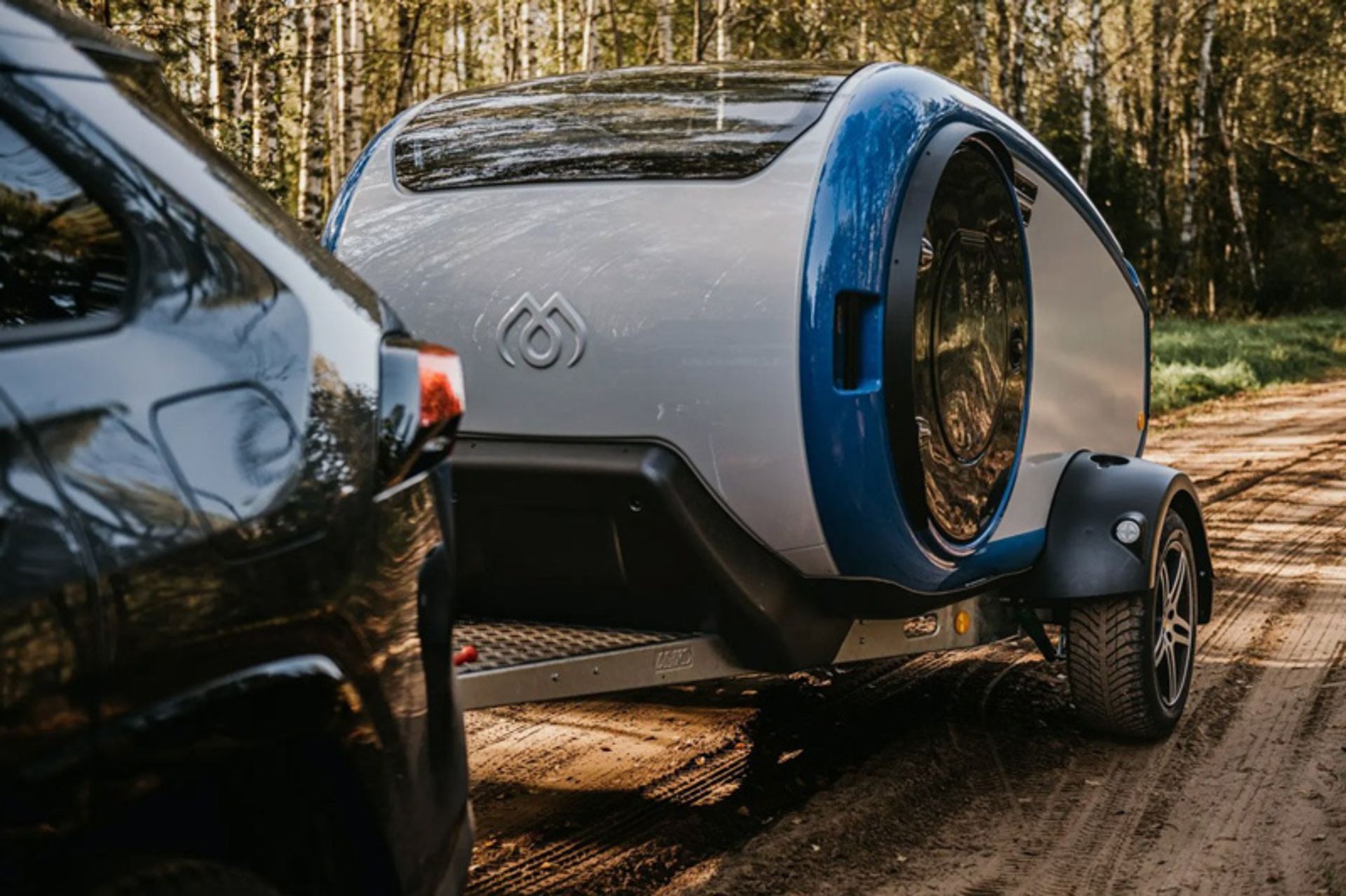 A car carrying a mink trailer