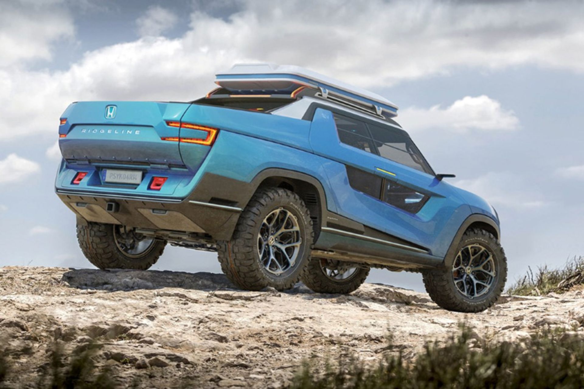 Ridgeline electric pickup with blue color on the mouain road