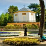 Tourists shooting in the nature of L -Capricho Madrid Park