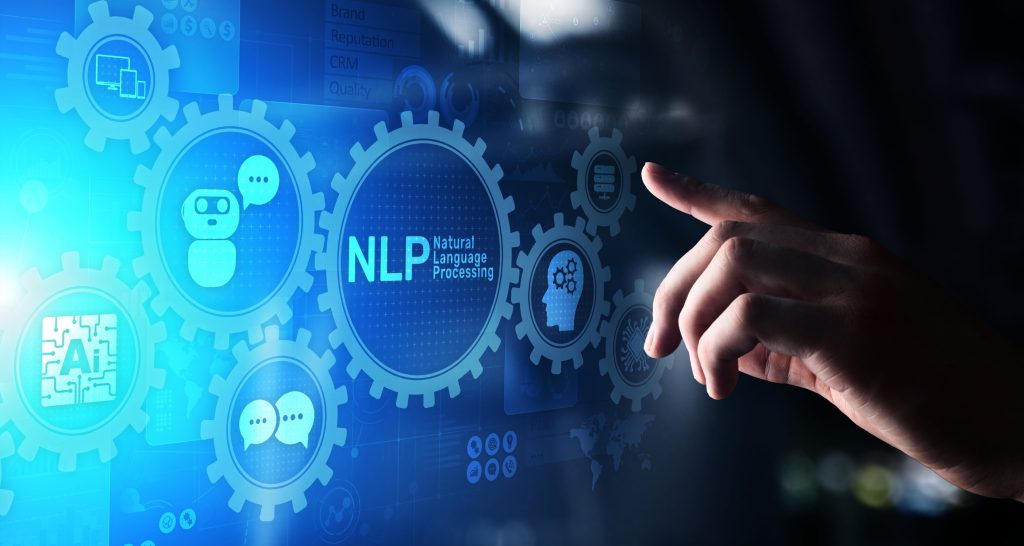 A person's hand touching a scrim picture with nlp written on it