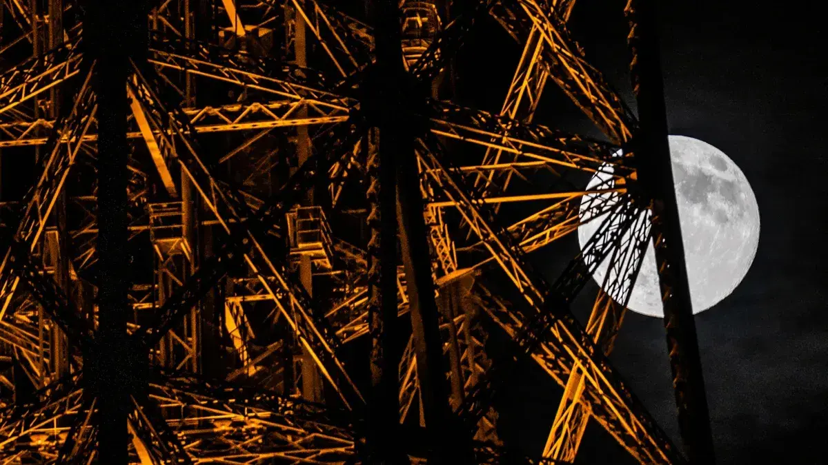 The moon next to the Eiffel Tower