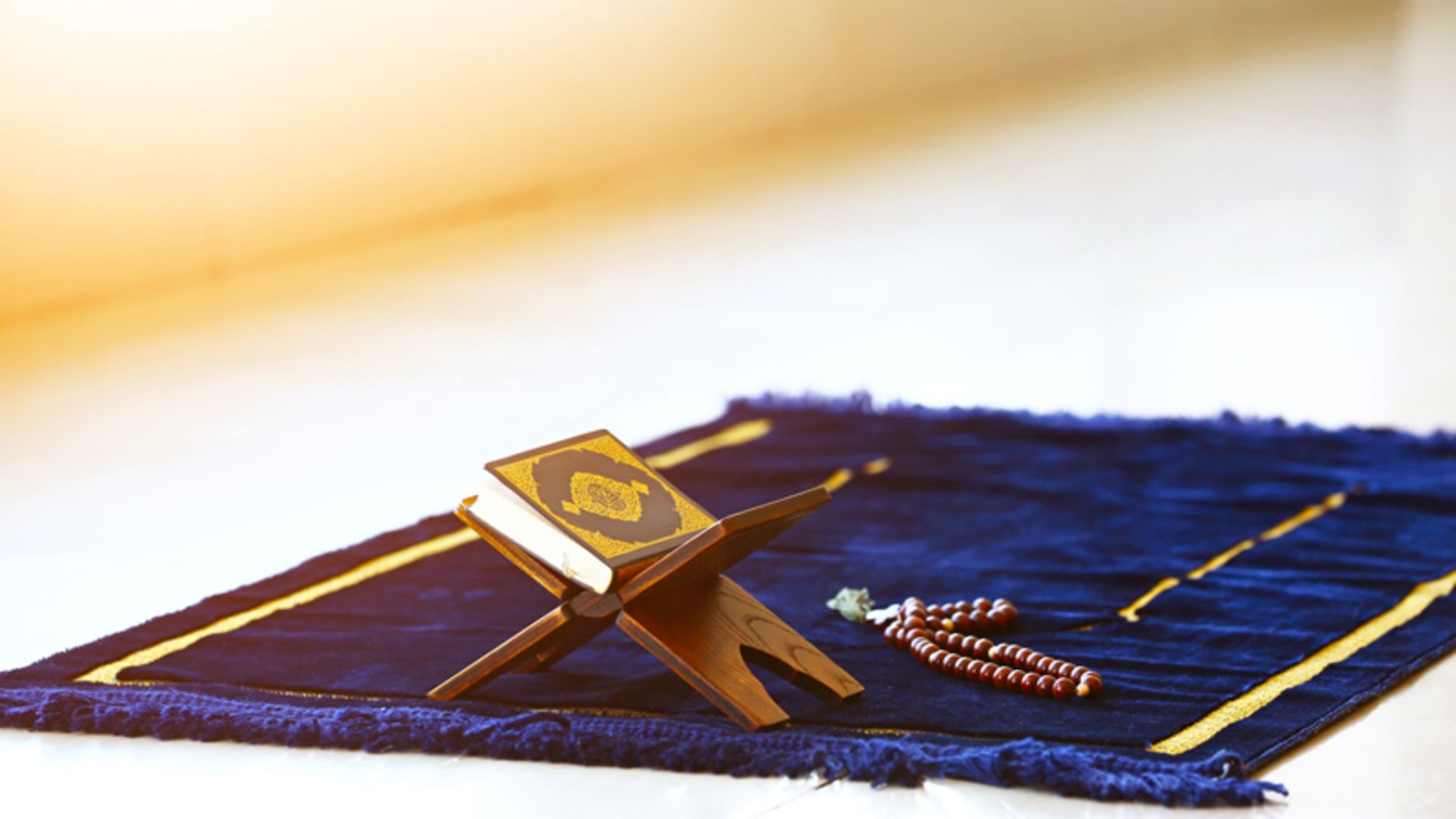 A blue carpet with the Qur'an