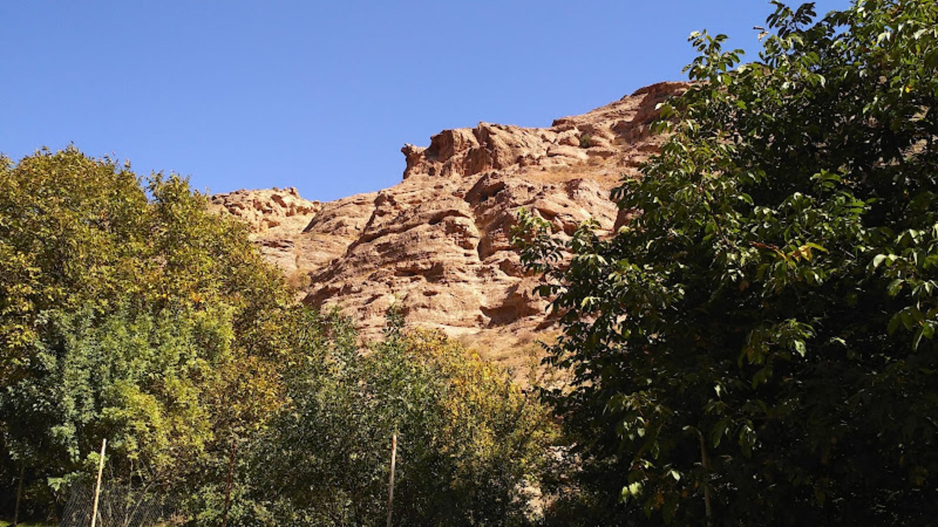 Huge rocks and green trees of Mashhad Damavand village
