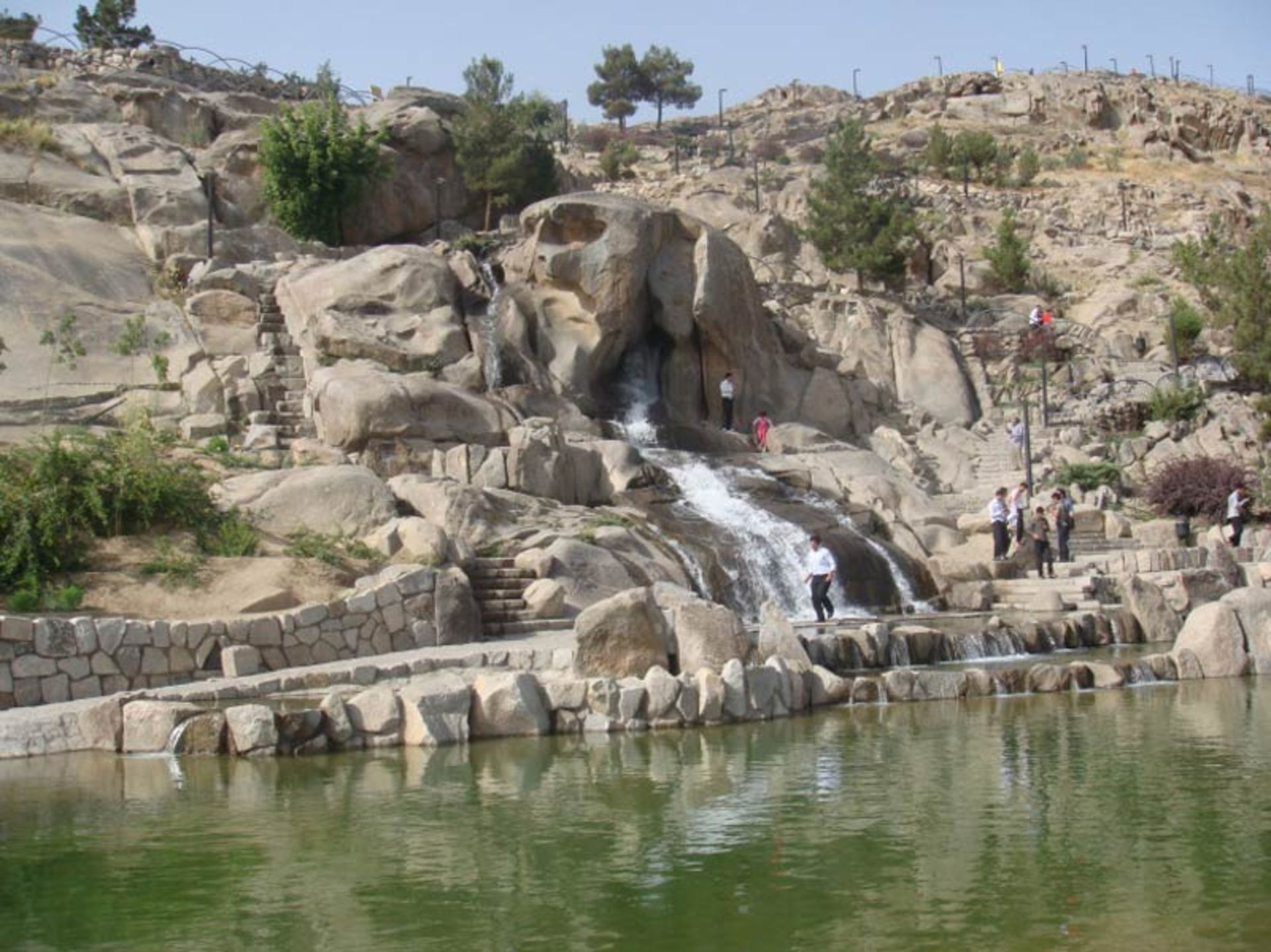 Mouain park lake in fro of artificial waterfall