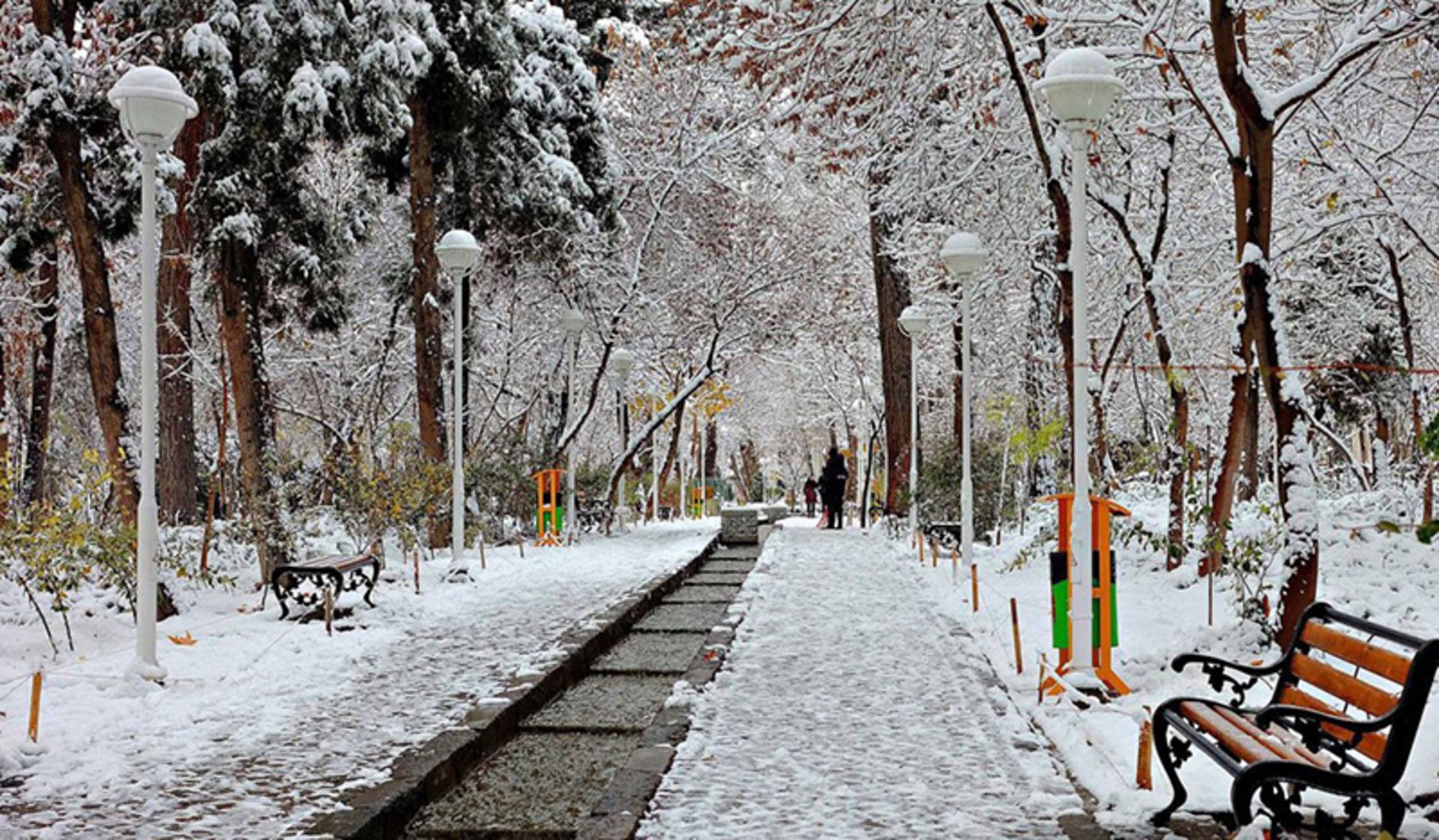 A whitewashed view of a park in Mashhad