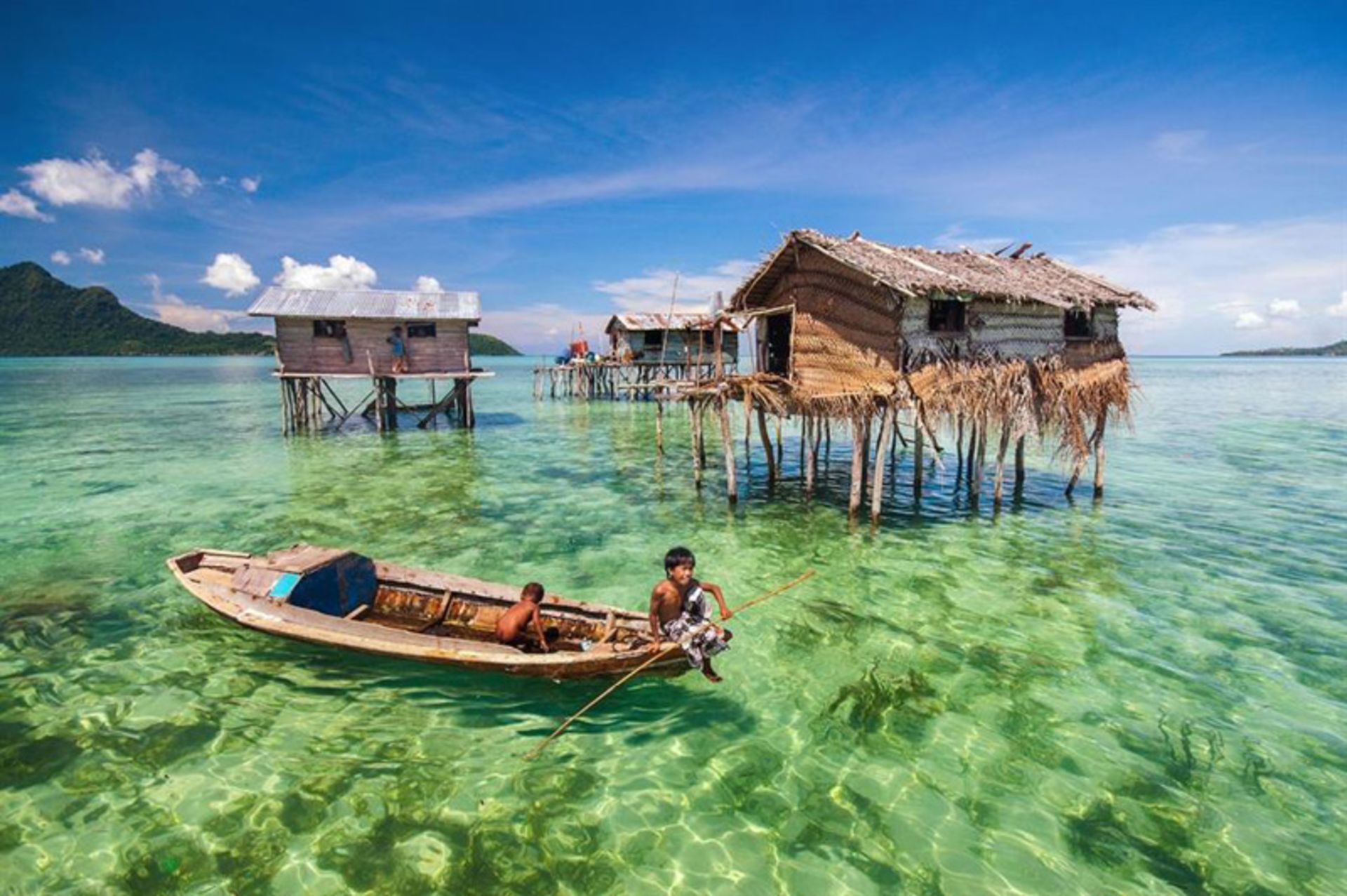 Bajau seafaring children on a boat