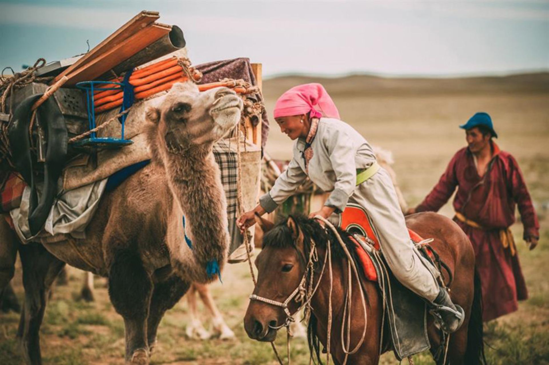 Mongolian woman on a horse