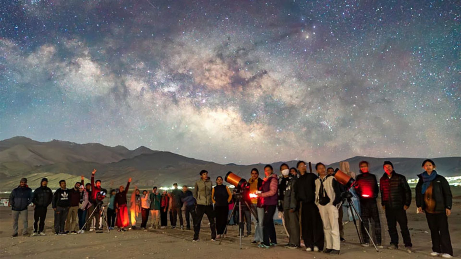 A group of amateur astronomers and astro-tourists under the Milky Way in Hahnle