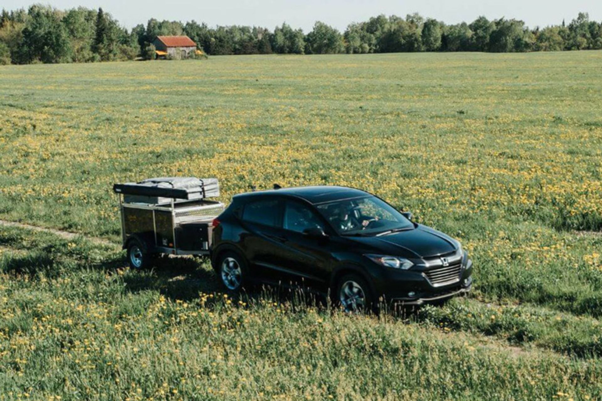 Genimax trailer moving with a sedan car