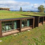 Wooden rooms with green roofs of Hotel Uina, Norway