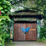 The wooden entrance gate to Pirela ecological garden