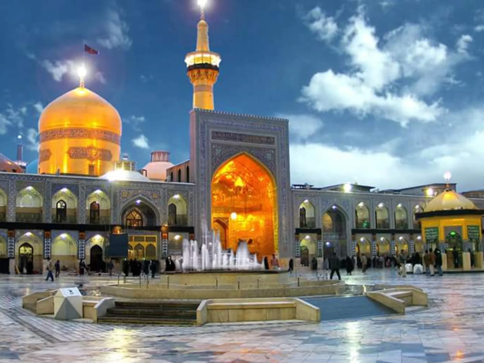 Azadi courtyard of Imam Reza shrine under the blue sky