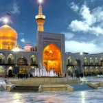 Azadi courtyard of Imam Reza shrine under the blue sky