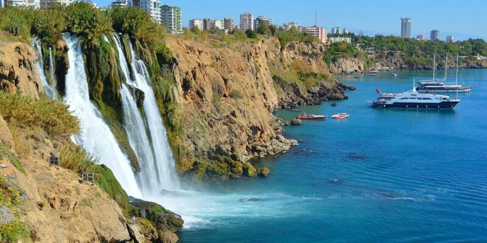 Duden waterfalls in Antalya and white boats