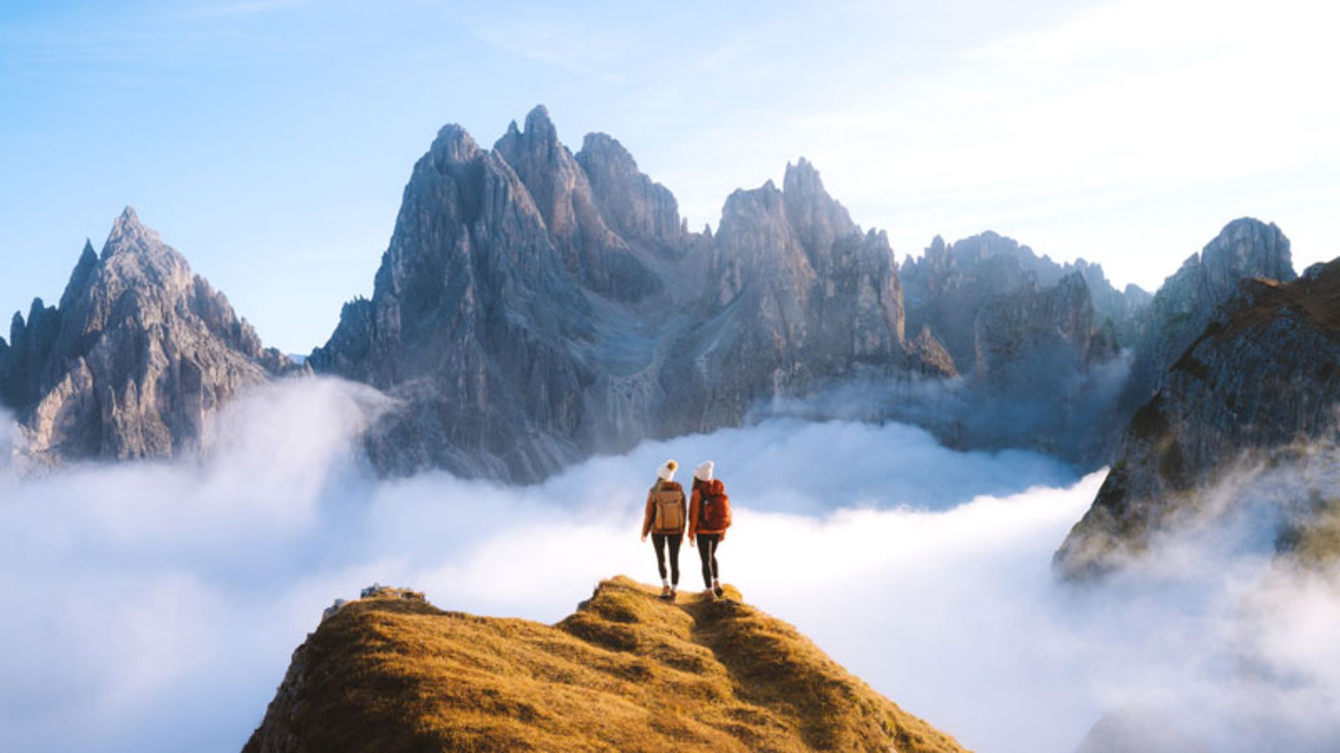 Climbing above the clouds among the Dolomite peaks of Italy