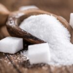 Sugar and sugar on a wooden table