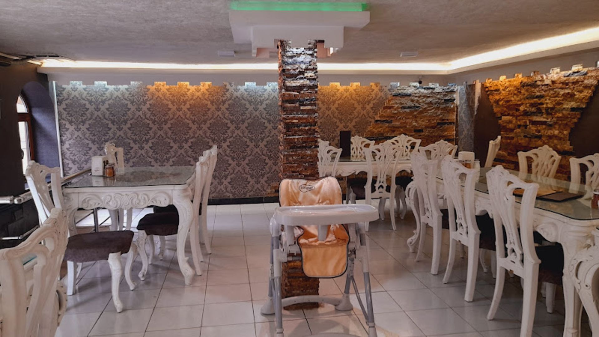 White tables and chairs of Darvish Shahroud restaura