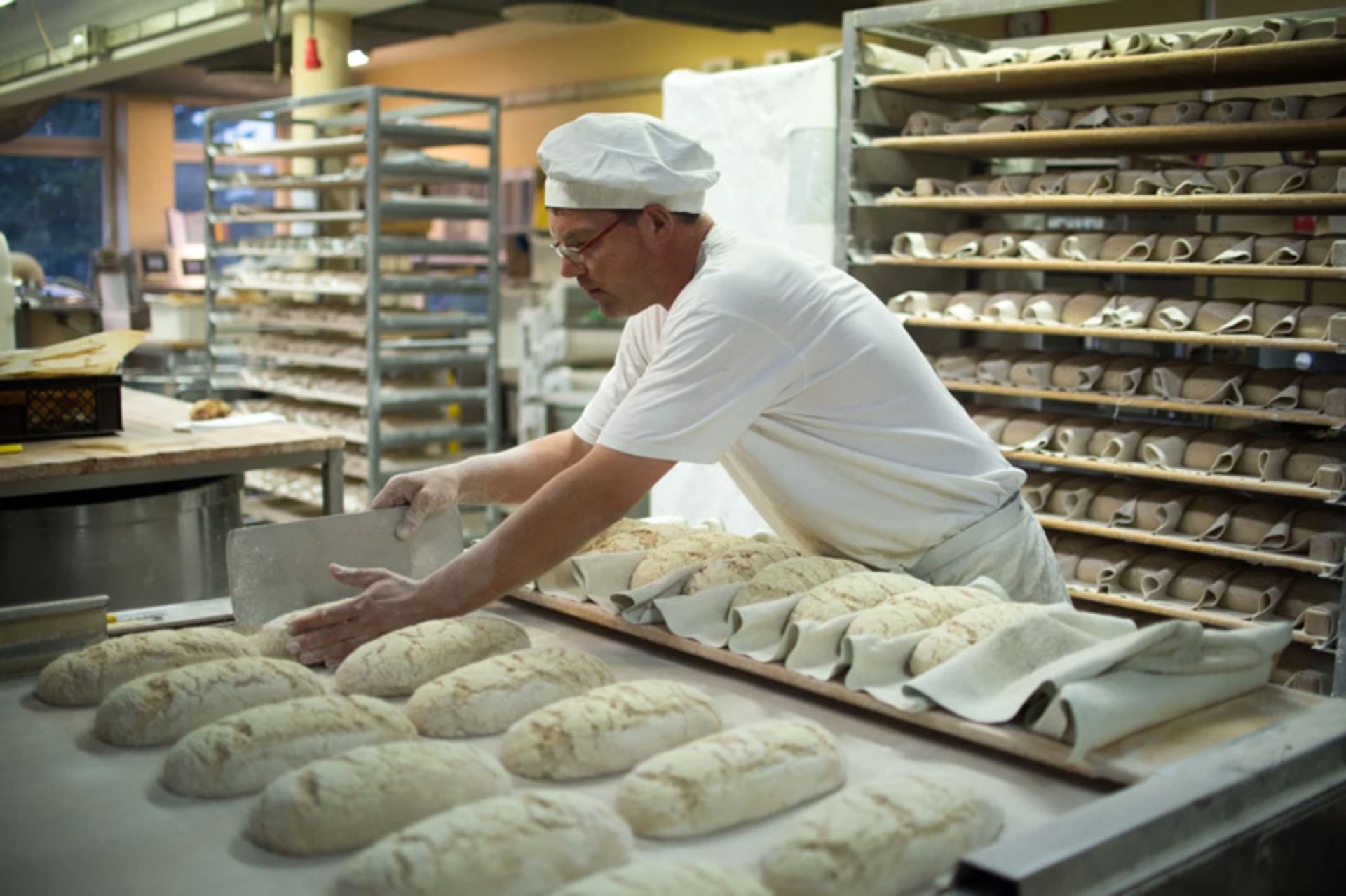 German baker making dough