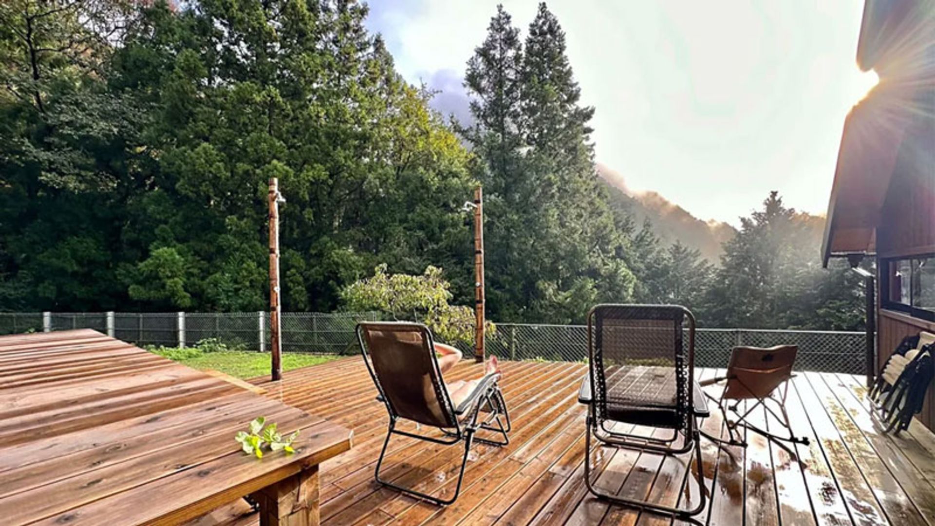 A wooden terrace facing the forest in a Japanese coury hotel