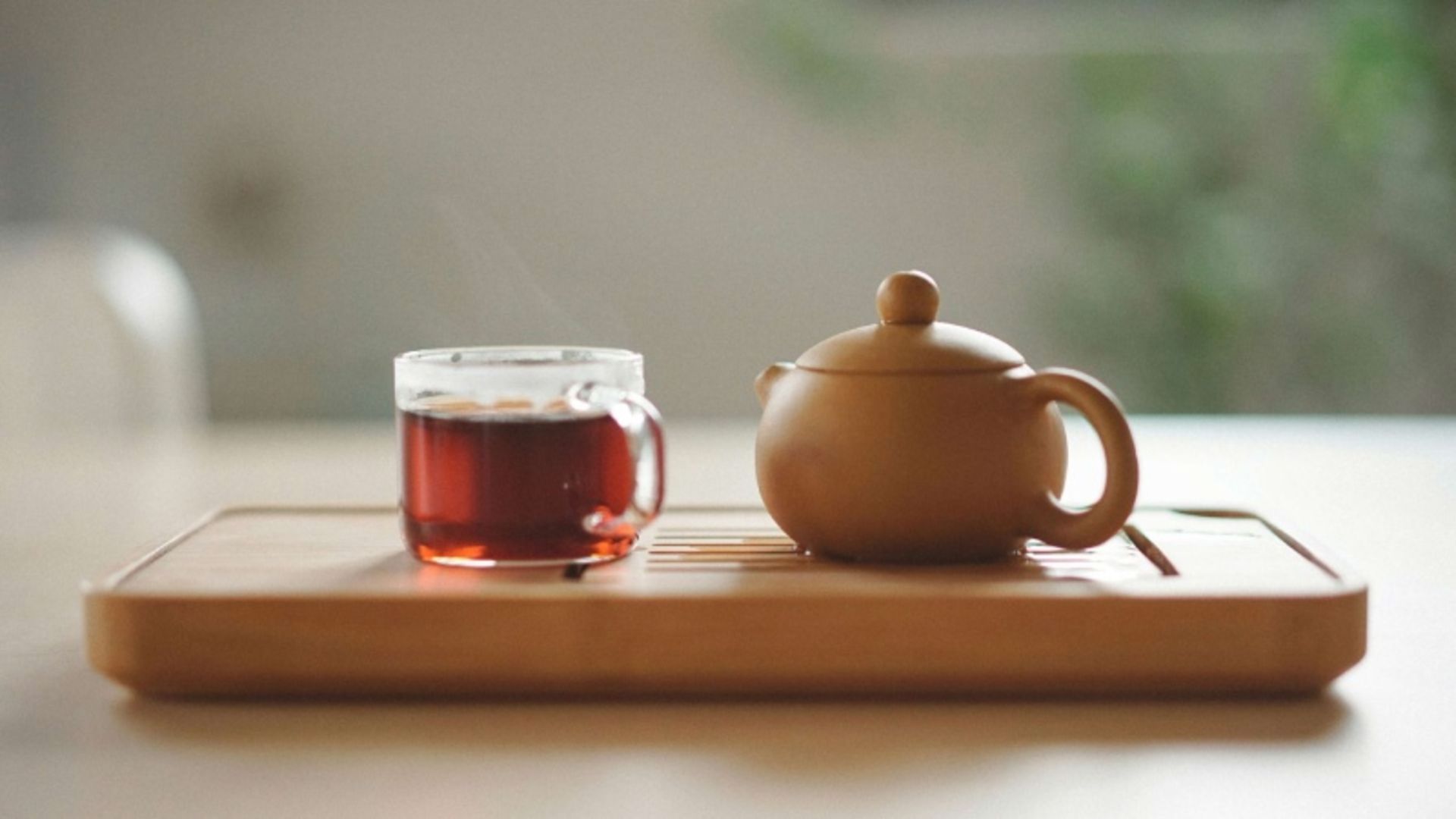 Tea in a glass and teapot