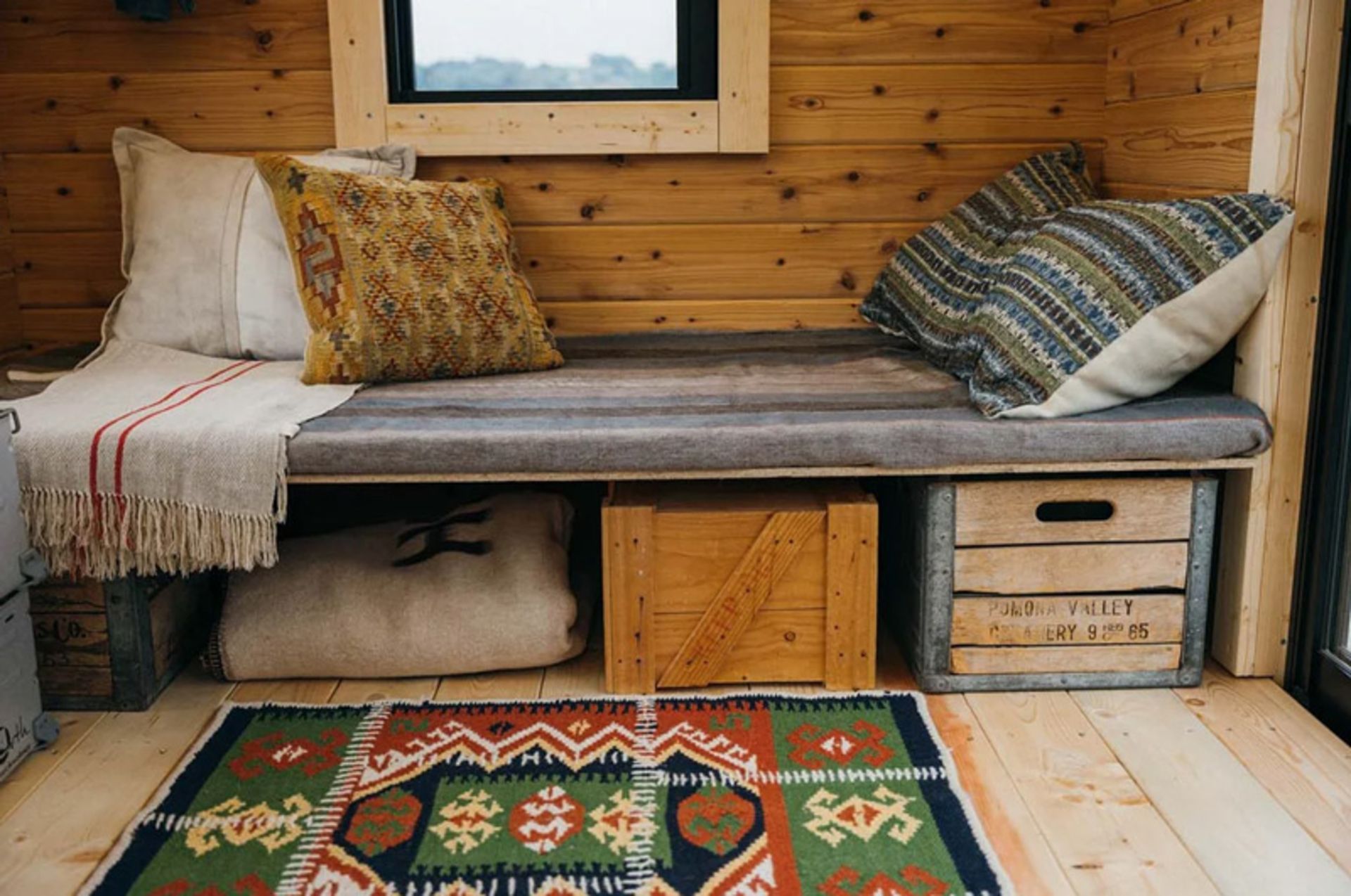 A bed in the ierior of the mobile hut