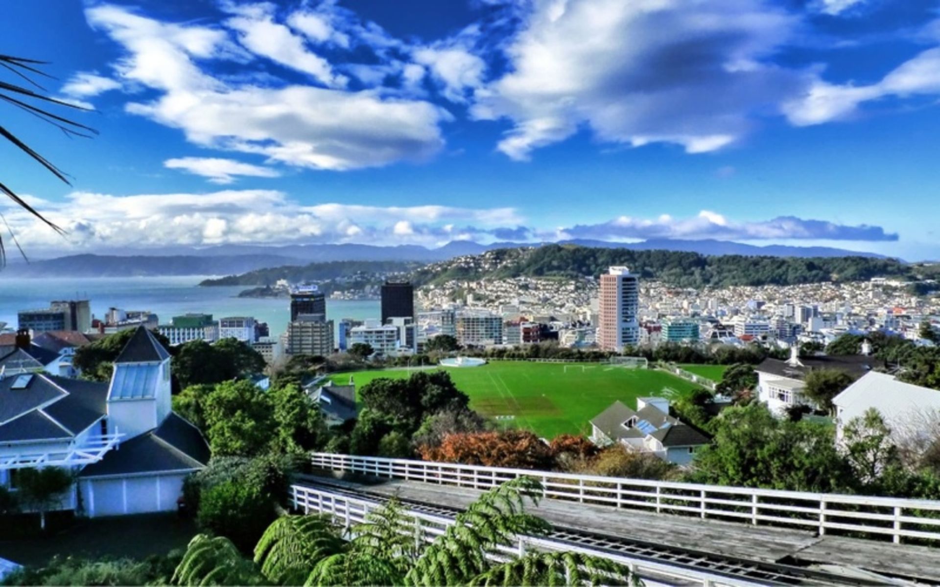 New Zealand cityscape under partly cloudy sky