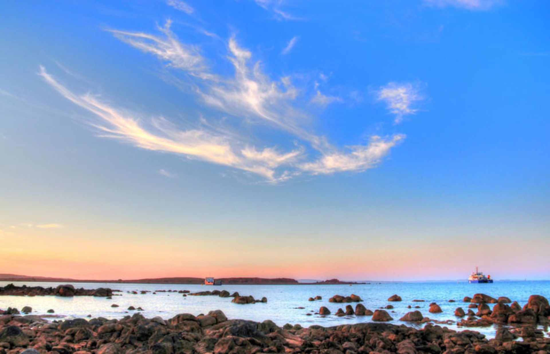 Calm sunset on the rocky shore of Barrow Island