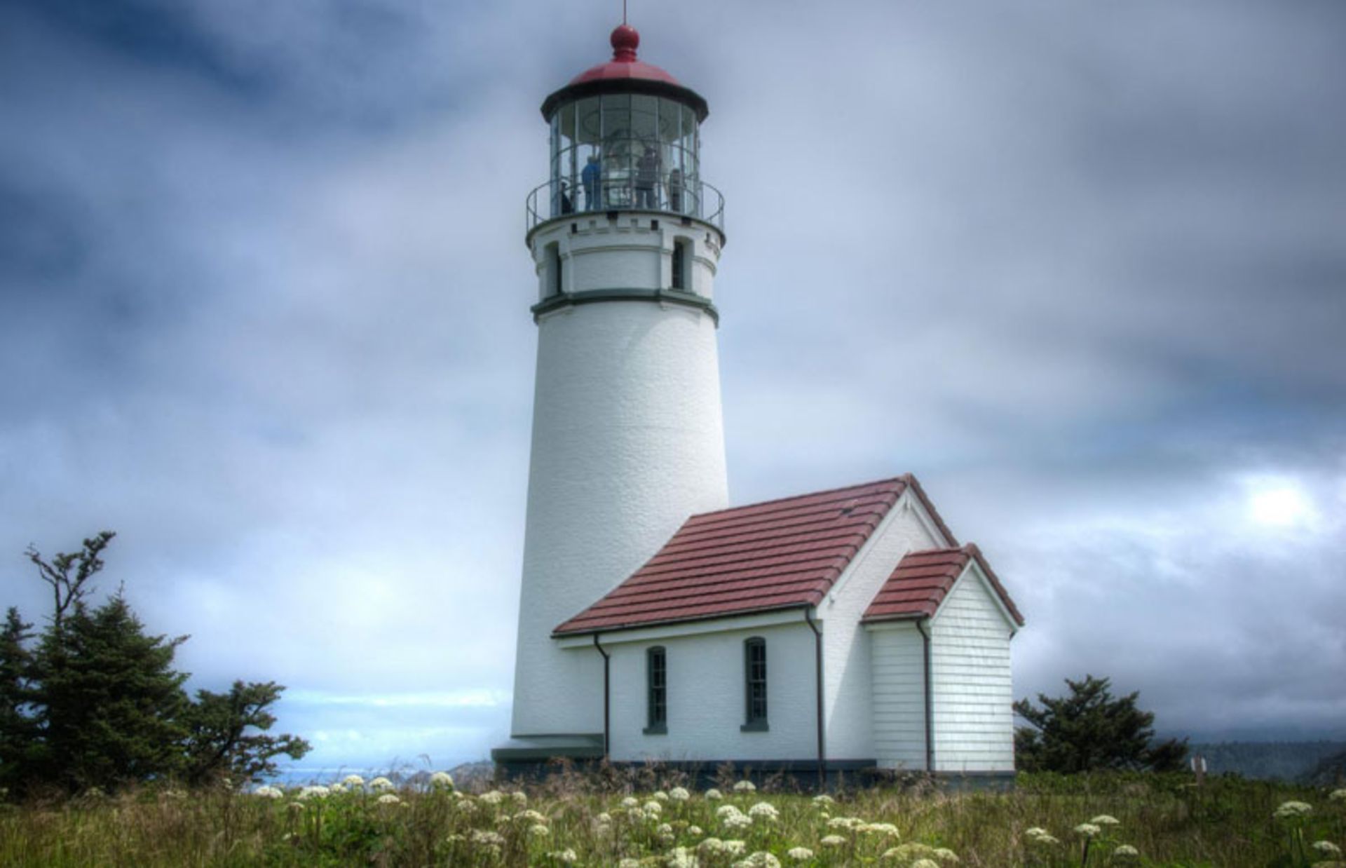 An old lighthouse standing in the coastal meadows