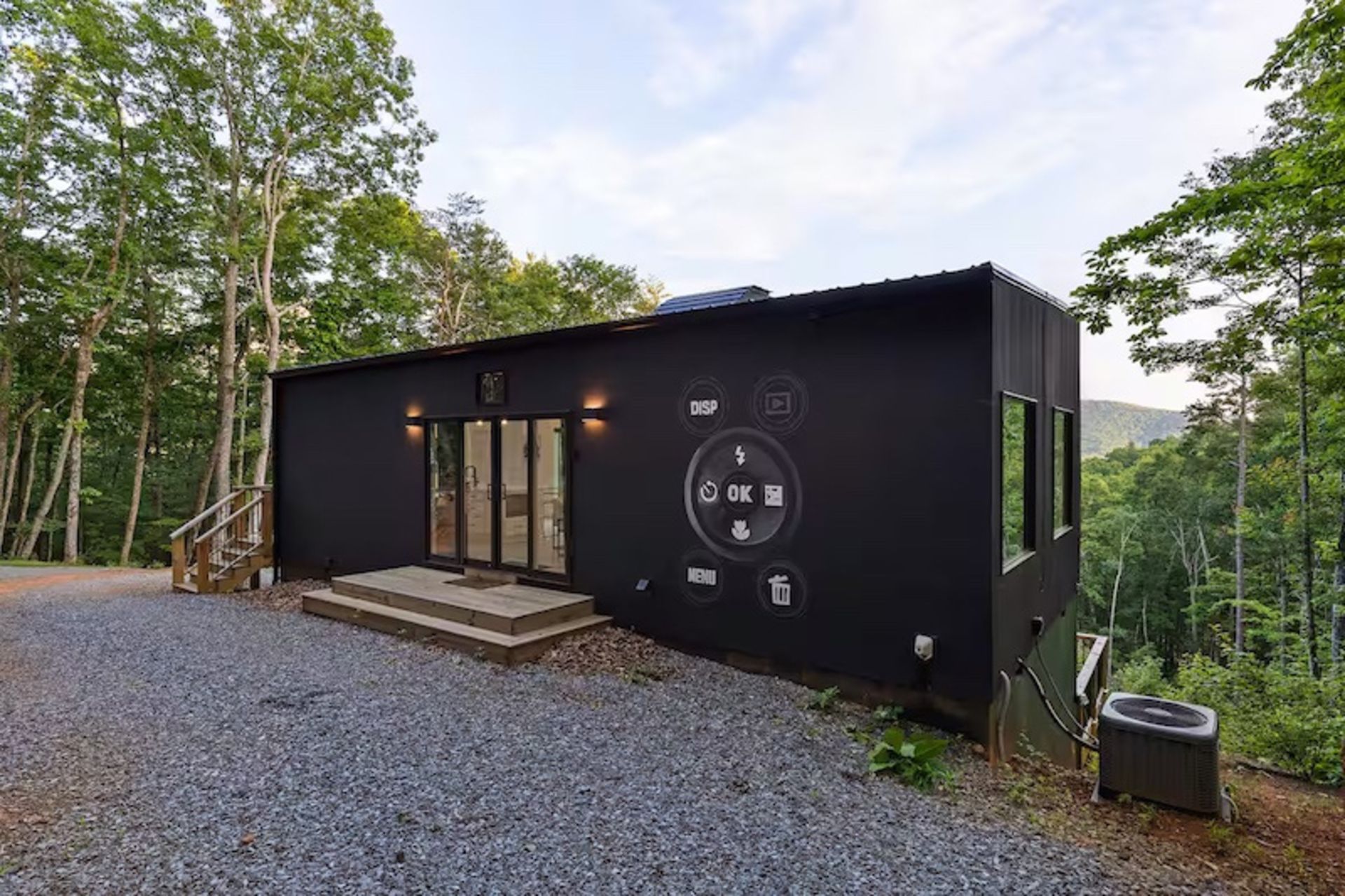 The back view of the camera hut in the forest
