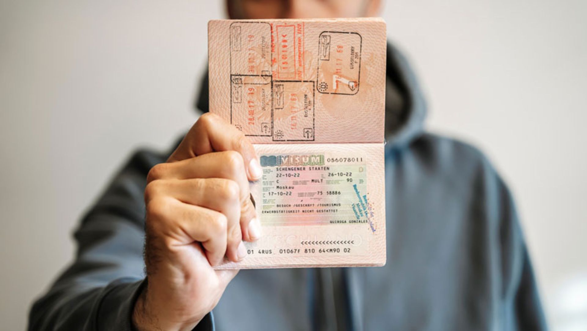 Display of Schengen visa and ery stamps in a passport