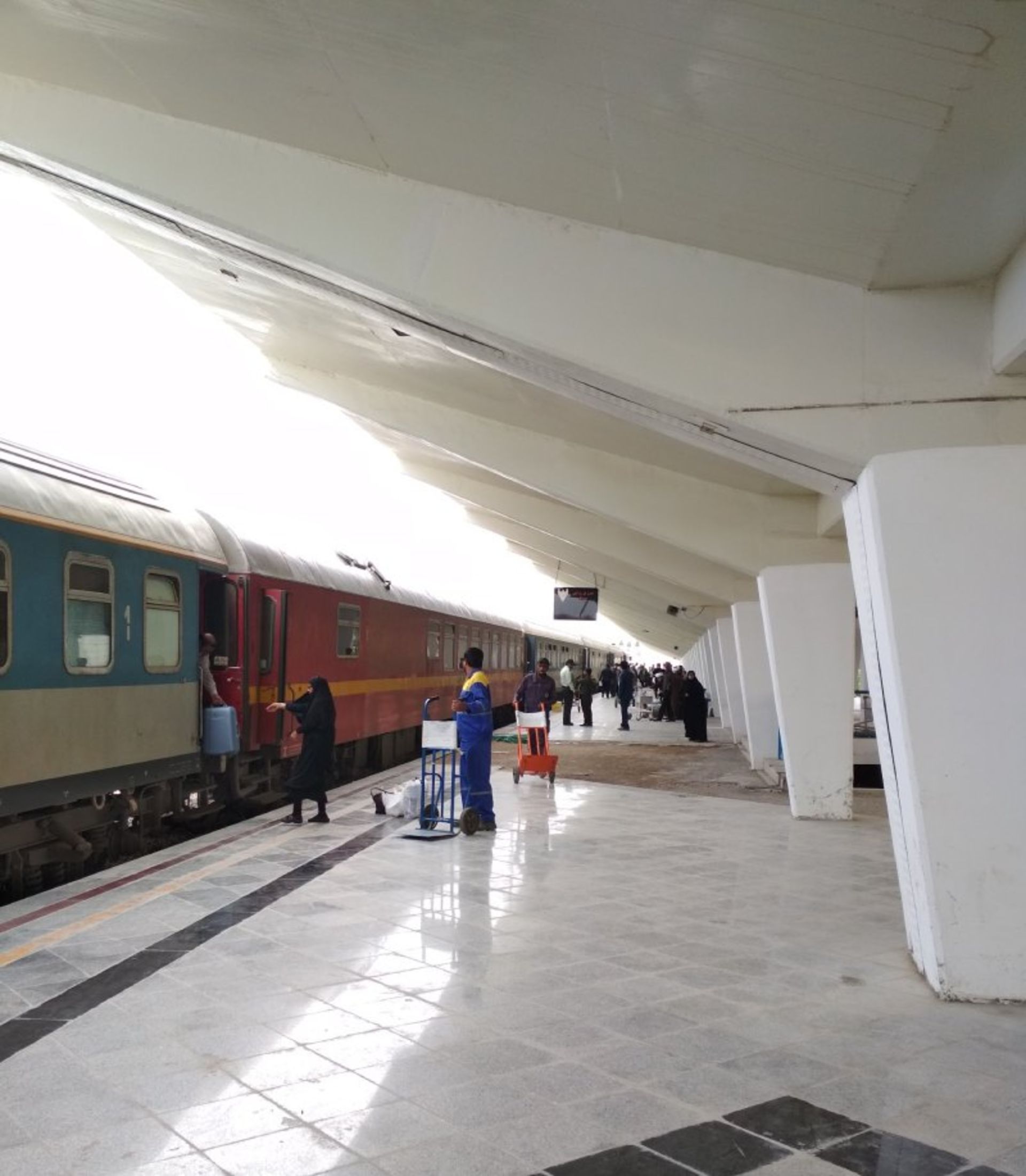 Passengers and trains at Bandar Abbas railway station