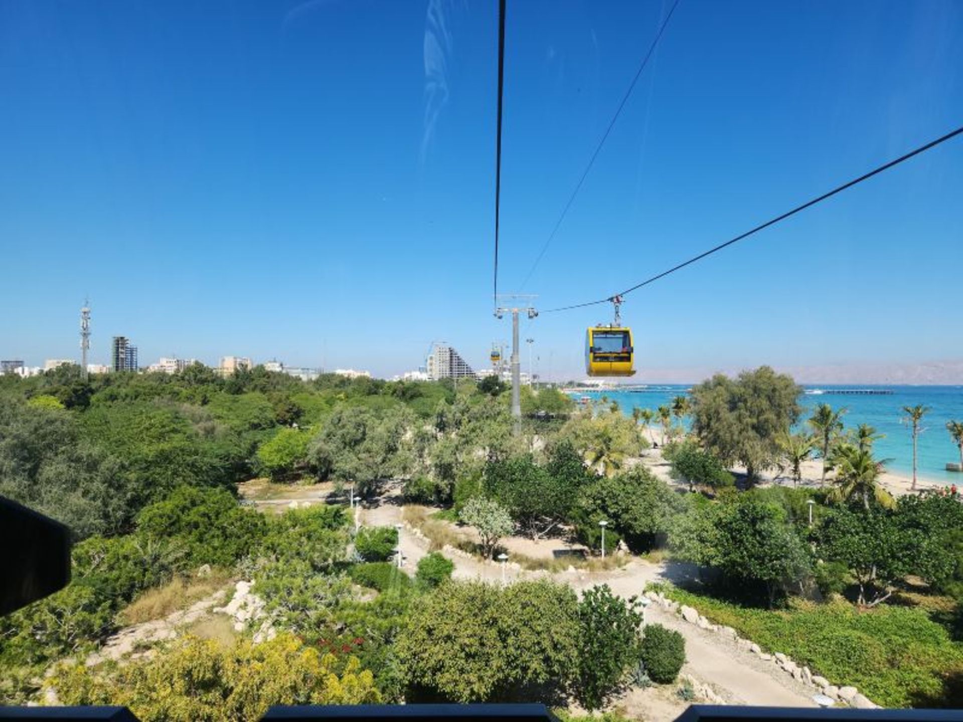 Mikamal cable car and surrounding greenery in Kish