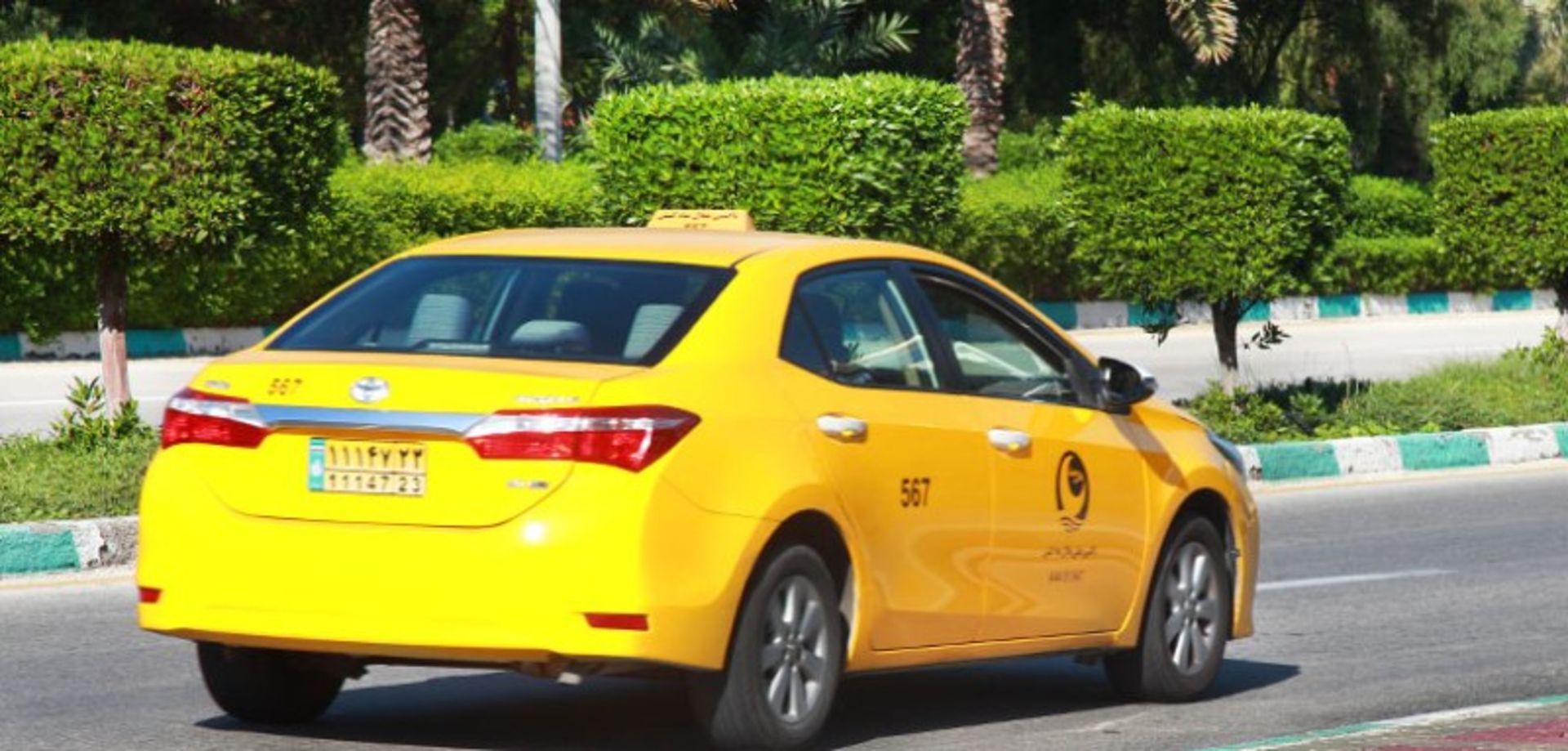 Yellow taxi on Kish Island Street