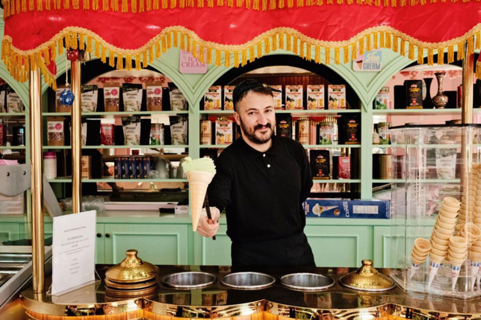 Turkish vendor serving traditional Dondurma ice cream 