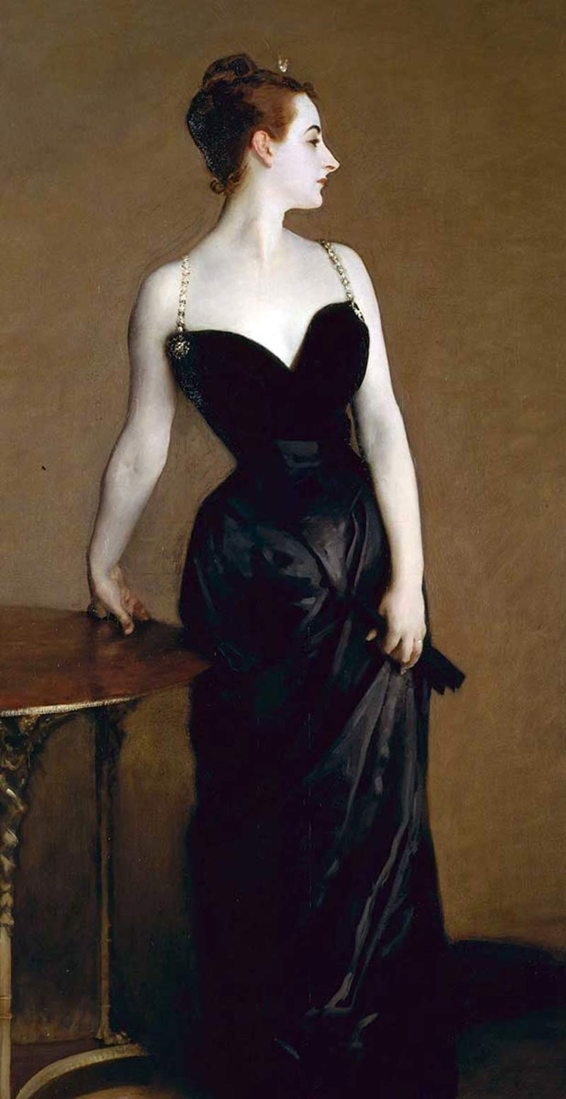 Profile of a woman in a tight black nightgown with thin jeweled straps