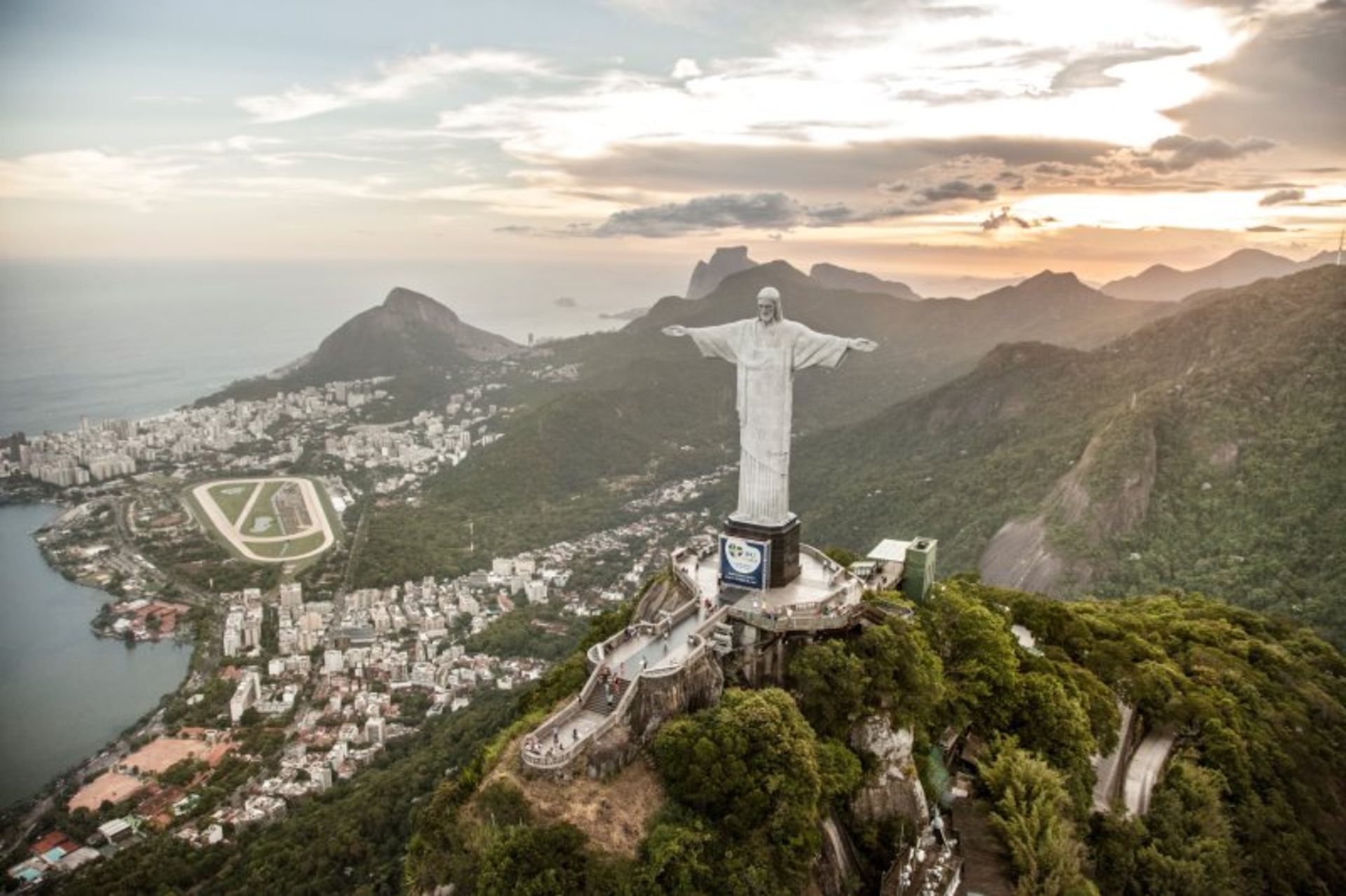 The statue of Christ the Redeemer and the nature and urban coext around it in Brazil