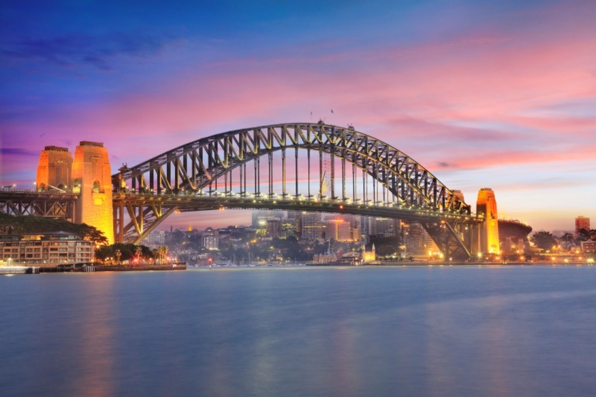 Illuminated Sydney Harbor Bridge over the sea