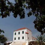 The building of the National Slavery Museum of Angola through the trees