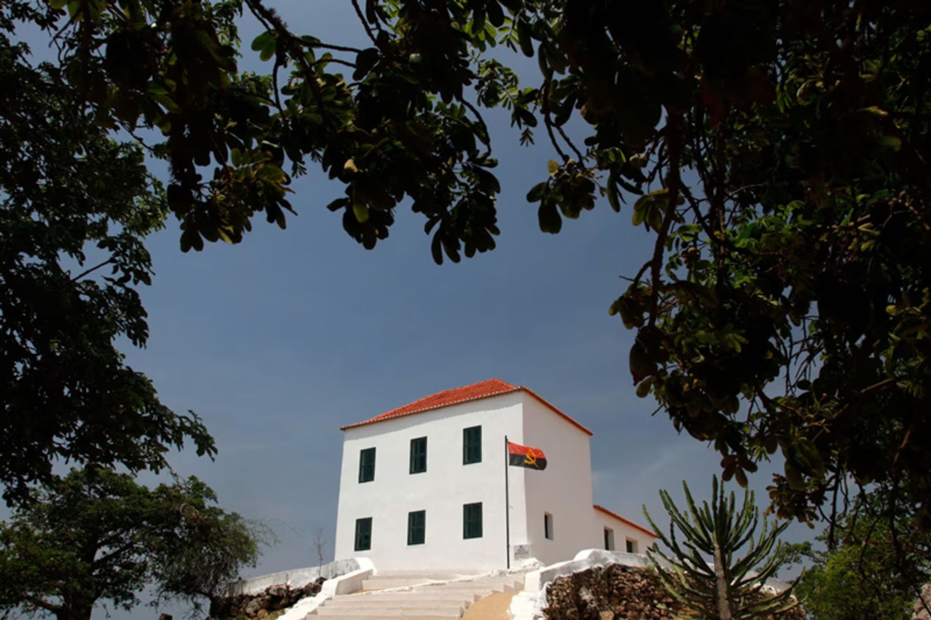 The building of the National Slavery Museum of Angola through the trees